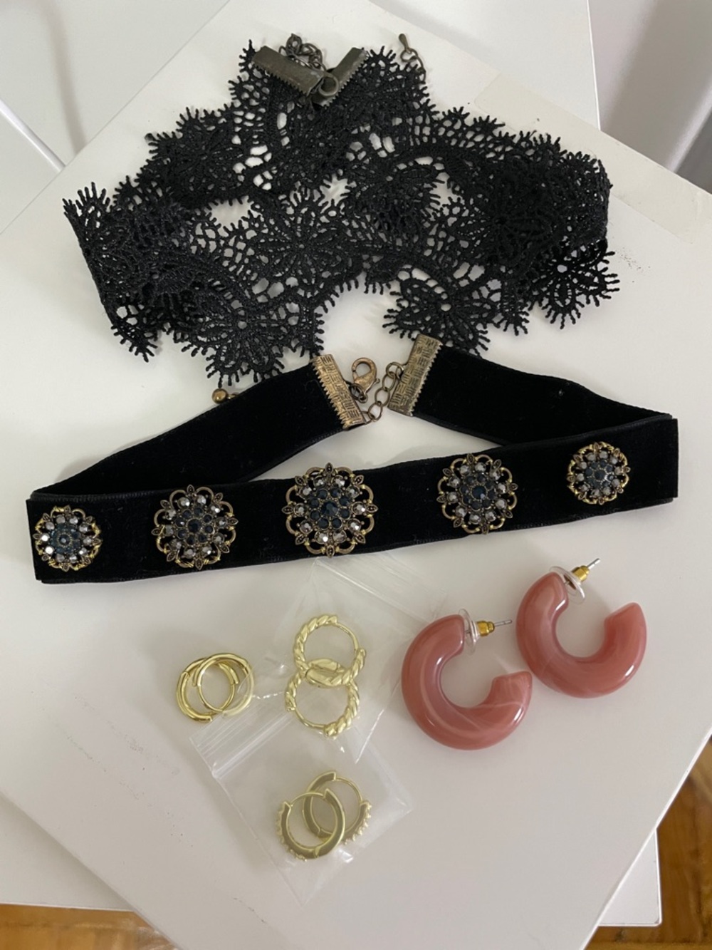2 chokers and 4 pair of earrings